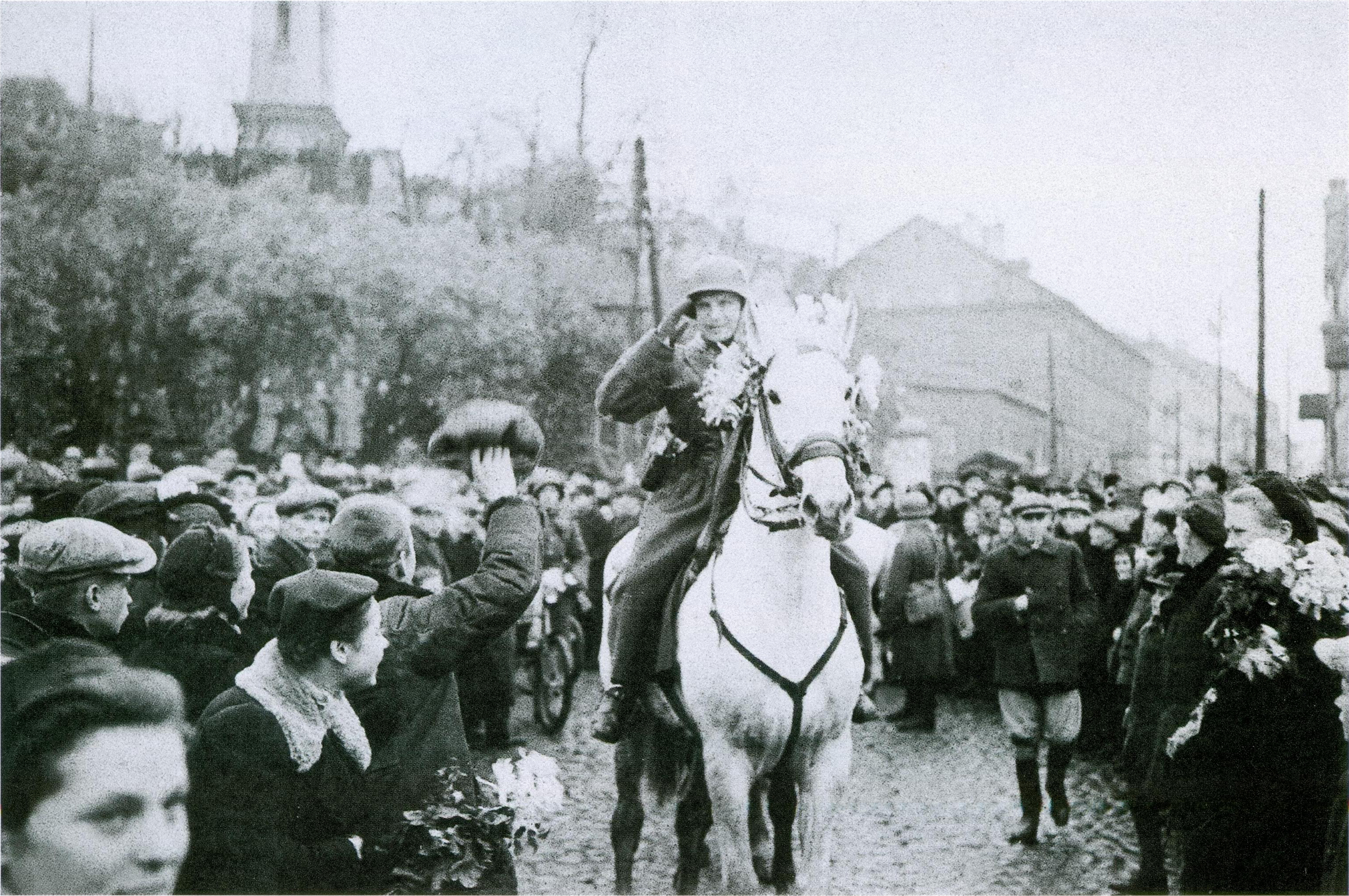 M. Brazaitis. Vilniečiai sutinka įžygiuojančius Lietuvos karius prie Žaliojo tilto. 1939 10 28